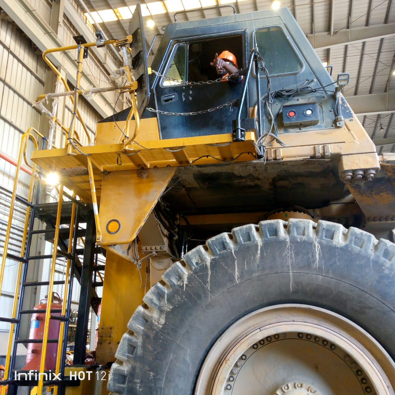 Heavy mining truck in a workshop